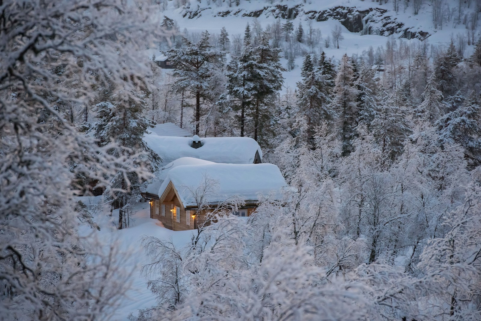 Timber cabin in a snowy Norwegian landscape